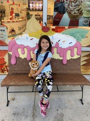 Cute ice cream benches in front of the store.