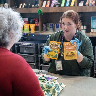 Before the final check out process, customers review their products at The Source Cannabis Dispensary in Northwest Arkansas.