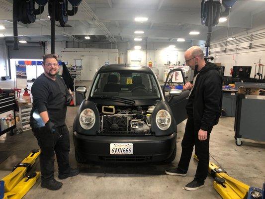 Shelbert and Darin working on a Think EV.
 
 Earthling Automotive specializes in electric vehicles.