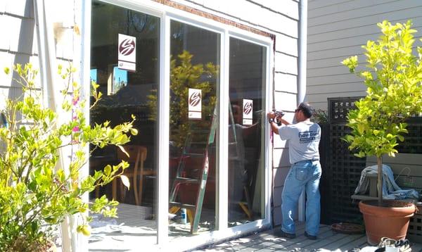 Luis, one of our full time installers, is installing a 3 panel Simonton sliding patio door at a home in Petaluma.