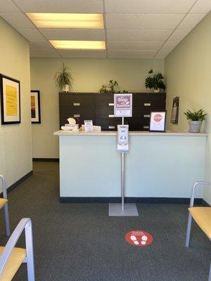 Waiting room with reduced chairs and social distancing