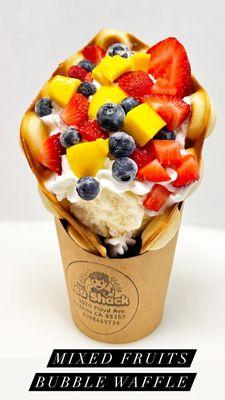 Bubble waffle with vanilla ice cream top with mixed fruits