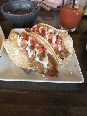 Tilapia fish tacos. Not great, I don't recommend. Too basic, no flavor. Had to add lime, tapatío and pico to make it taste decent.