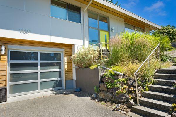 This elegant renovation creates a contemporary look, with James Hardie paneling and stainless steel flashing.