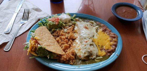 Two item combo platter with carnitas taco and chicken enchilada verde.