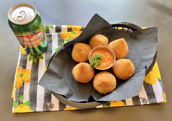 Coxinha, another Brazilian favorite, is a cooked dough stuffed with shredded chicken. Pair perfectly with Guaraná (the soda from Brazil)