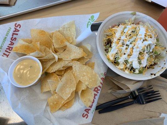 Chicken bowl with chips and Queso