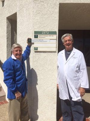 John K Evans, DDS and John B Chrispens, DDS hang Dr. Evans sign in Newport Beach!