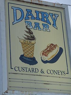 D&N on the cone. Never understood why people put pictures of some of their item on their signs.