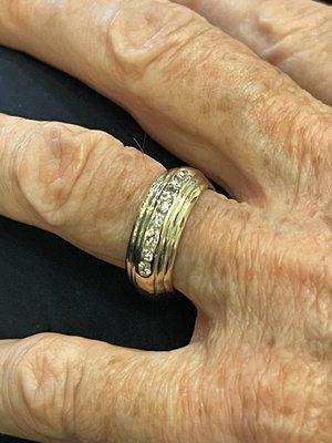 Finished product delighted my mother with my Dad's wedding band "hugging " both sides of her band