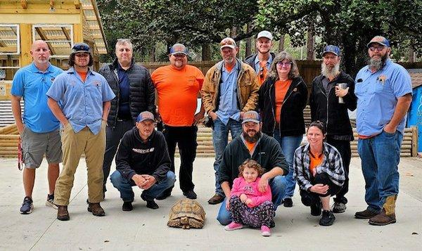 Some of our Fort Walton Beach team members meeting Wolfgang the African Spurred Tortoise that Mills Heating & Air is sponsoring.