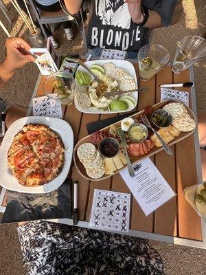 Charcuterie board, baked Brie, Dolcetto pizza