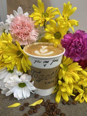 Free flowers the cafe offers for you to take to brighten your or someone else's day with a vanilla hot latte