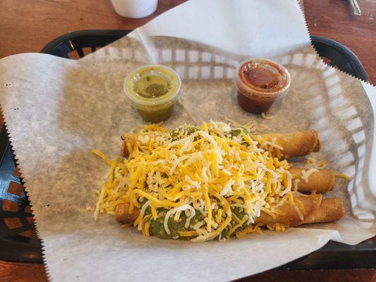 3 taquitos. Guacamole & cheese with a Verde & hot salsa on the side.