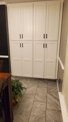 Use to be a useless desk area. Now floor to ceiling pantry with pull-out shelves!