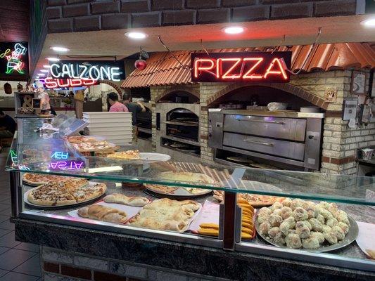 Pizza ovens behind the serving counter.