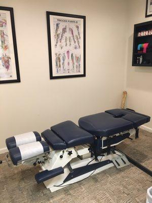 Out of our many treatment rooms feature our flexion distraction table.