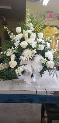 Beautiful large funeral floral arrangement.