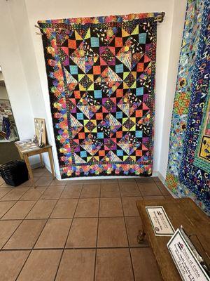 shop entry with a very fun, colorful quilt