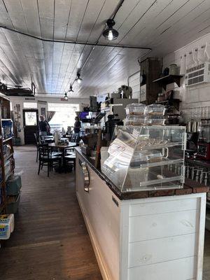 Specialty coffee bar with dining area in background