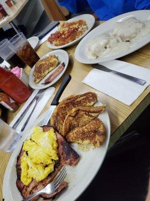 French toast with ham and eggs. Biscuits with bland gravey & hashbrowns. The soda had a funny taste.