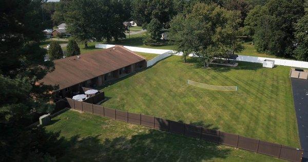 Private outdoor space with pavilion and volleyball area