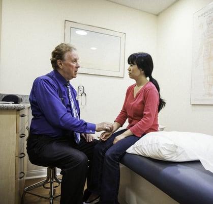 Dr. Kevin Lance Jones with a patient.