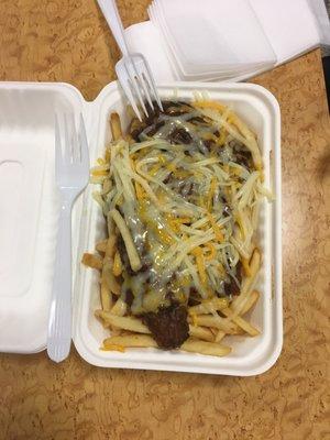 Chili cheese fries, large. Fork for scale.