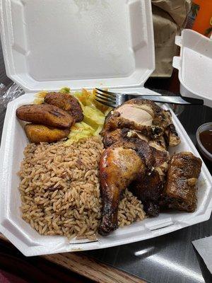 Large jerk chicken, rice and peas, steamed vegetables and plantains.