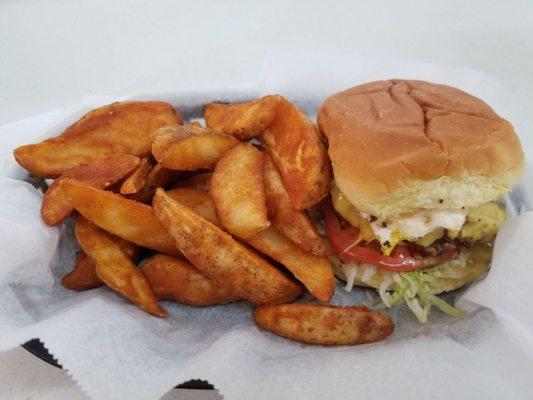 Bacon burger with fried egg and wedges