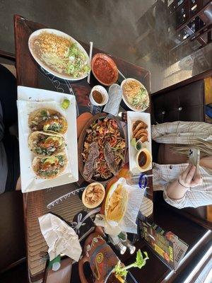 Tacos de birria, quesabirria tacos, and the fajitas rodeó. They even put the shrimp on the side for us since my wife is allergic.