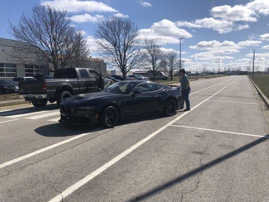 They pulled this $130K mustang out of the showroom for some idiot to test drive and he put it in the curb in front of the dealership!