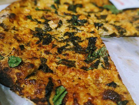 Paneer Tikka pizza with spinach added ($13)