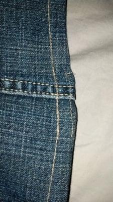 The ugly messed up hem on my expensive jeans.