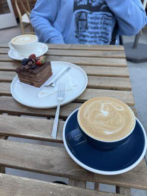 Cappuccinos and a chocolate cake