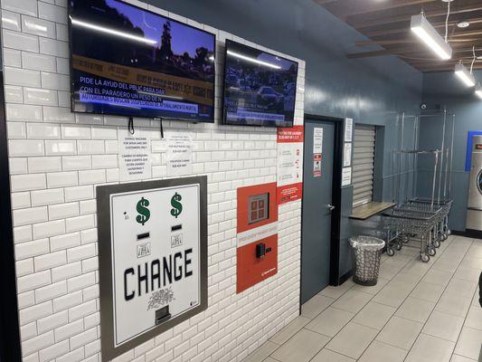 Coin laundromat with change machine and TVs