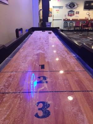 Shuffle board! Missing a blue puck and no extra sand but still playable :)