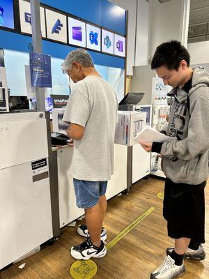 Grandpa & grandson ready to make a transaction