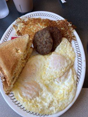 Two Egg Breakfast with Sausage, scattered hashbrowns and smothered (sautéed onions)