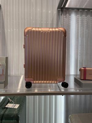 Super pretty pink metallic carry on bag.