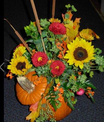 Fresh pumpkin arrangements with a beautiful fall mix.