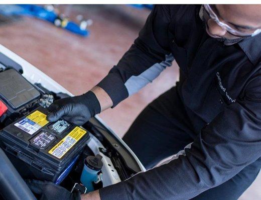 Jim Ellis Chevrolet service tech changing car battery