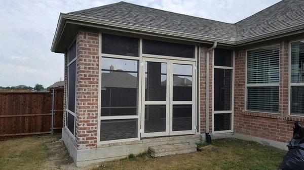 Screened in patio extension with asphalt roof