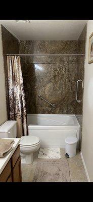 Bathroom remodel: $17,387 did not include the toilet, sink or counter.