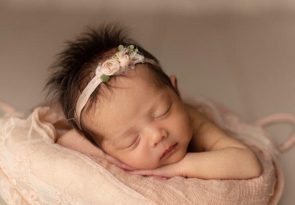 Baby girl happy and fed with the help of Ms. Ashley. Photo by Candice Berman Photography