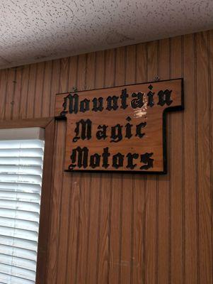 Mountain magic motors sign in the office