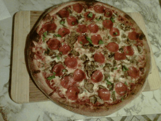 Mushroom and pepperoni pie with fresh basil!