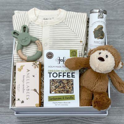 Baby Gift Box, tea, stuffed animal, toffee, honey hard candies, teething ring, bamboo baby sack, packaged in a luxury gift box.