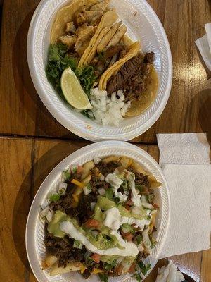 Chicken tacos, and a barbacoa taco, carne asada fries