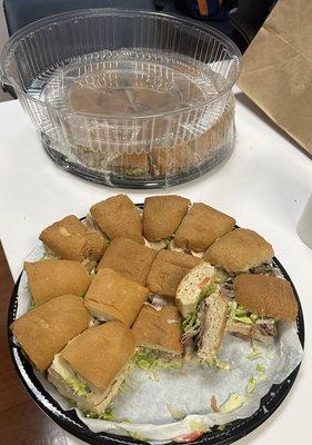 Catered variety sandwich trays. Staff already got into it